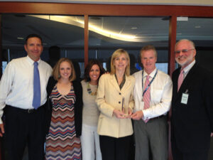 Partnership for a Drug Free NC's Steve Kline (right) presents a national award to FOX 50's Doug Dickman, Robin Lindner, Michelle Garrett (l to r), Joanne Stanley, & Matt Donegan.